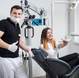 Woman in dental chair with Dallas dental office manager Tony