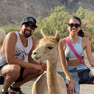 Doctor Tadros with his wife and a llama