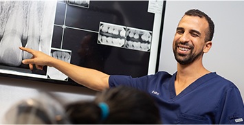 Doctor Tadros explaining dental x rays to a patient